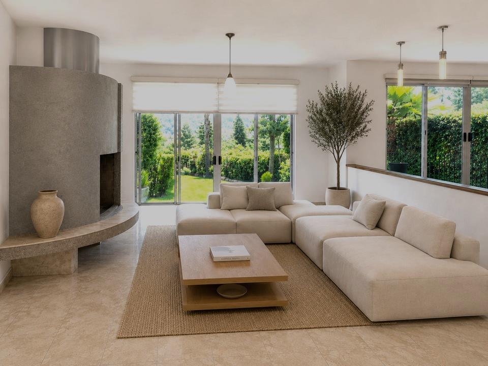 Sala con chimenea y vista al jardín